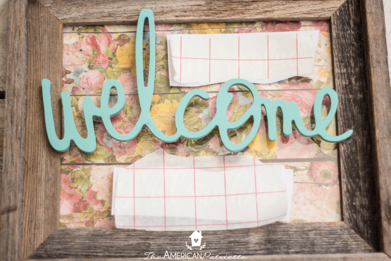 Colorful DIY Welcome Sign Using a Repurposed Frame - A super easy and ADORABLE DIY project that helps welcome guests into your home!